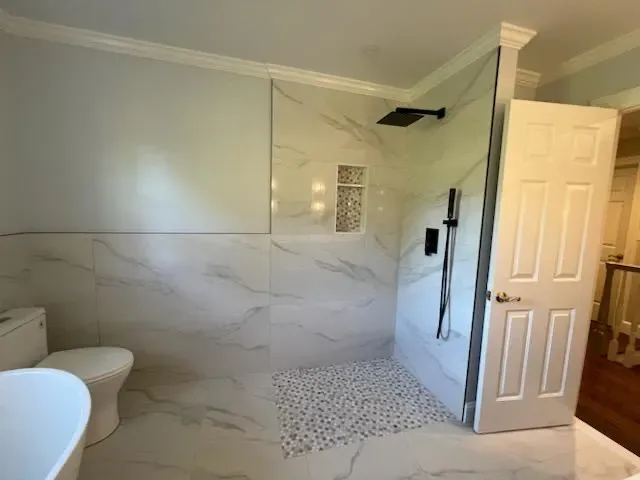 modern-bathroom-marble-glass-shower.webp